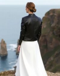 Modern bride wearing leather jacket over gown
