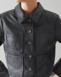 “Women’s cropped black leather jacket with button-up front and utility pockets”