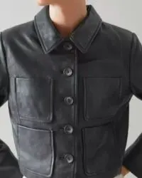 “Women’s cropped black leather jacket with button-up front and utility pockets”